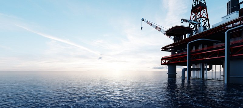 Offshore oil and gas drilling Offshore oil drilling platform on a calm sea at midday